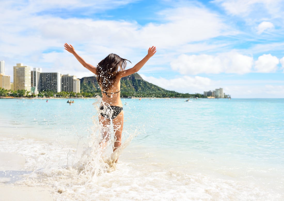 Golden Waikīkī shoreline with Diamond Head in the distance