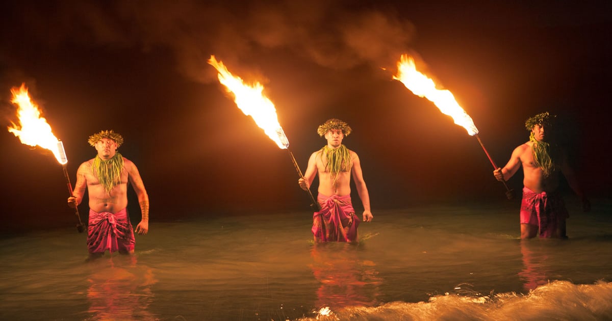 Oahu luau performers and audience at sunset