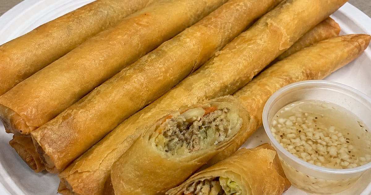 A platter of crisp golden Hawaii-style lumpia with sweet chili dipping sauce
