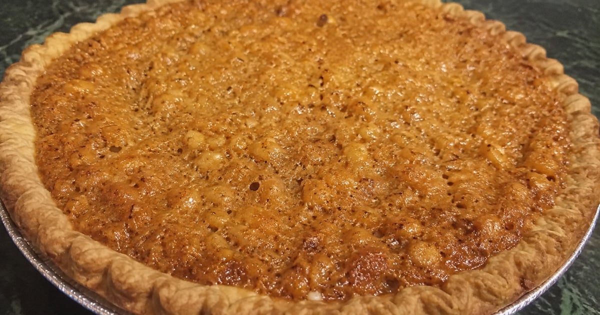 Hawaiʻi macadamia nut pie — toasted island-grown mac nuts in a brown-sugar custard, baked in a flaky crust