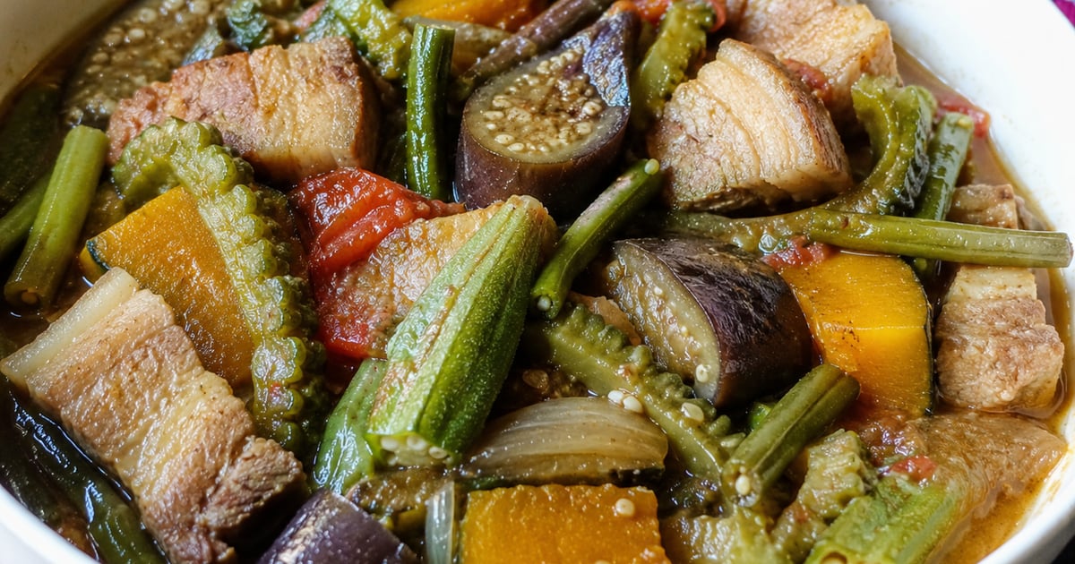 Filipino-Hawaiian pinakbet — bittermelon, eggplant, kabocha squash, and pork belly in a savory bagoong stew over rice
