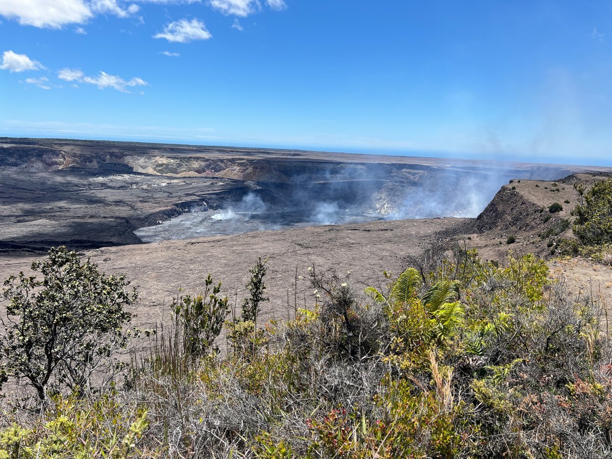 Daytime view of Kīlauea Caldera and Halemaʻumaʻu crater from a west-rim overlook inside Hawaiʻi Volcanoes National Park.
