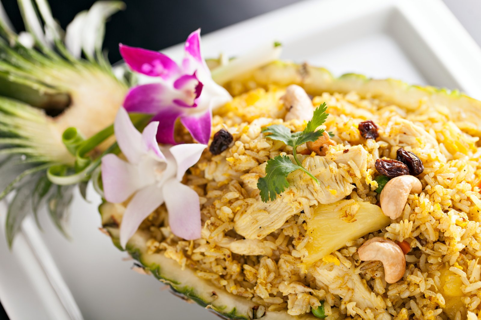 A spread of fresh, plated Hawaiian dishes featuring local ingredients