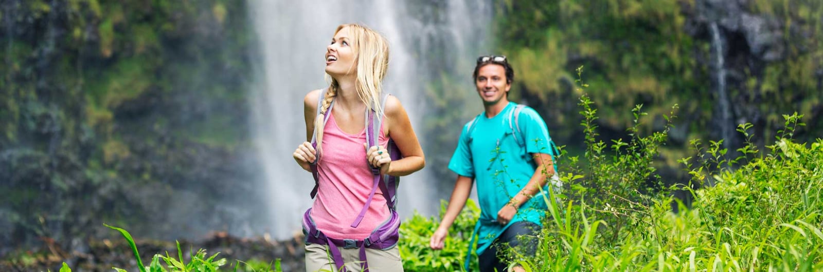 A waterfall on Maui surrounded by wet-season green — the kind of jungle payoff a slightly wetter fall trip earns you on windward hikes.