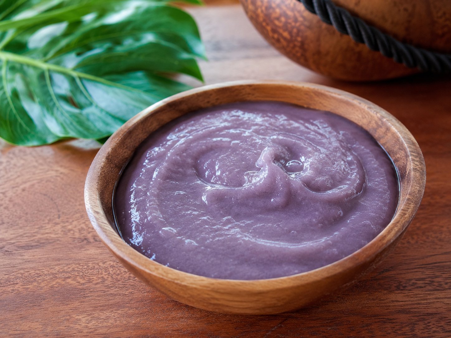 Hawaiian poi — pounded taro served in a wooden bowl
