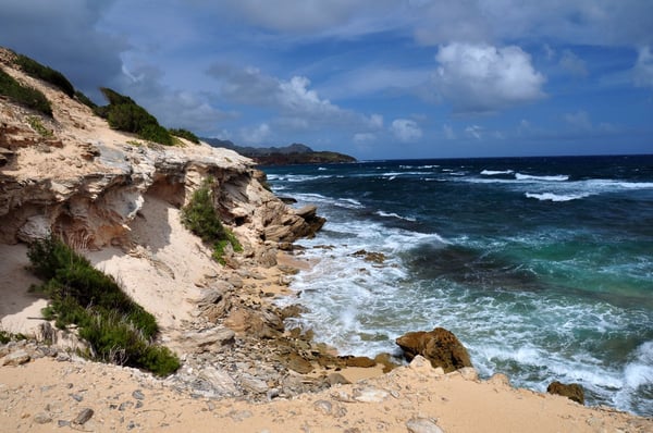 The wild lithified sandstone cliffs along the Māhāʻulepū coast on Kauaʻi