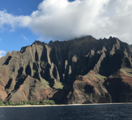 Fluted green cliffs of the Nā Pali Coast from the water, Kauai