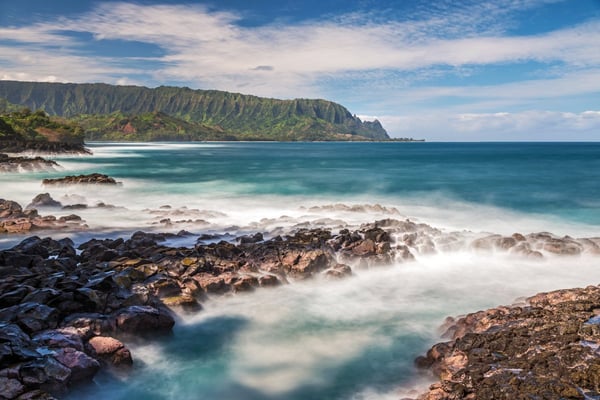 The rocky lava shoreline below Princeville at Queen's Bath on Kauaʻi