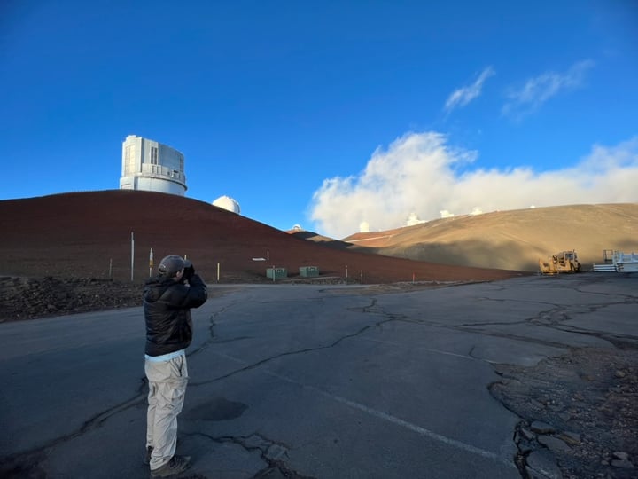 John photographing observatories near the Mauna Kea summit during a Hawaiʻi Forest and Trail tour
