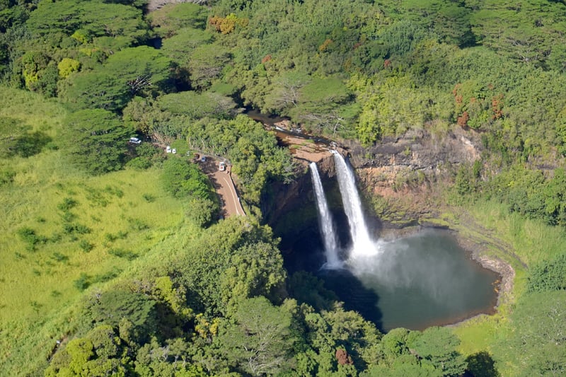 Helicopter flying over Kauai's Na Pali Coast