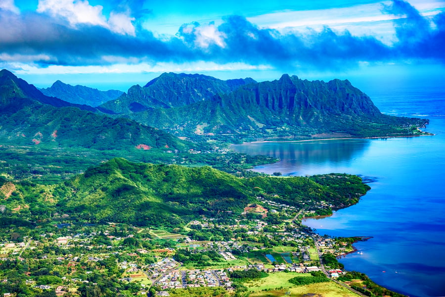 Rugged green Oʻahu coastline away from the city — the wild side of the island most visitors never see