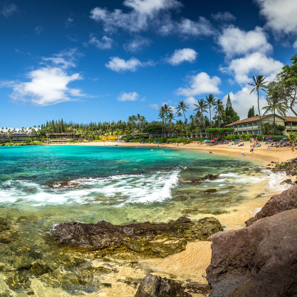 A calm, protected Maui bay in clear morning light