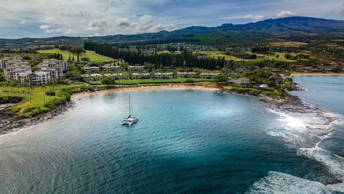 Kapalua Bay Beach with a sailboat in the water, one of the most popular beaches to visit in Hawaii