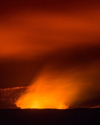 Brown rock formation with orange lava-like air coming out against a red-ish sky.