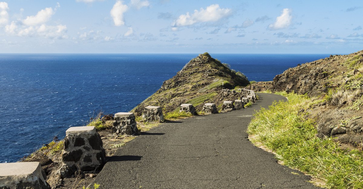 The hiking trail leading down Makapuu Point with an expansive view of the Pacific Ocean