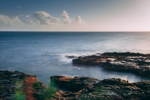 Some land, rocks, and water to represent the Hawaiian legend of Pele's curse in Hawaii